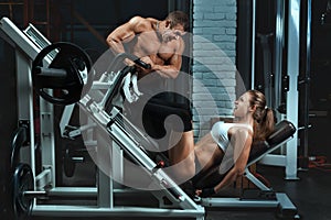 Man bodybuilder trains the a woman.