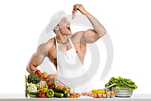 Man bodybuilder in white toque blanche and cook protective apron