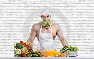 Man bodybuilder in white toque blanche and cook protective apron cooking cottage cheese and vegetables