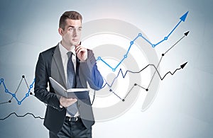 Man with book and growing graph