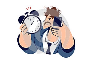 Man boss with alarm clock in hand calls subordinates reminding them that deadline