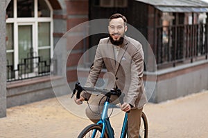 The man bought a new bike. The brunette rides a bicycle. Caring for the environment