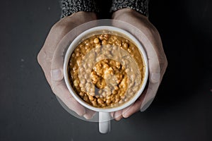Man with a bowl of lentil soup