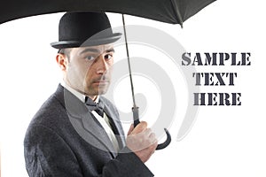 Man with bowler hat and an umbrella