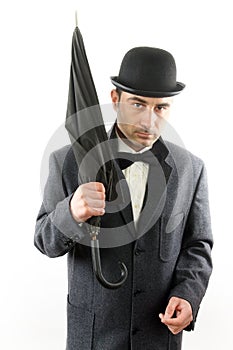 Man with bowler hat and an umbrella