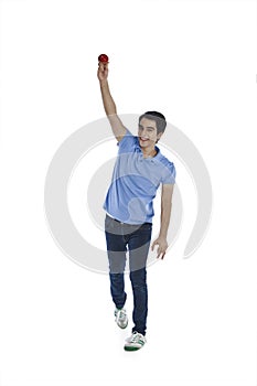 Man bowling a cricket ball