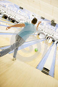 Man bowling, rear view