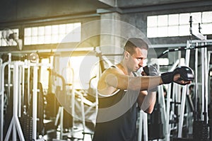 Man boxer punching at a boxing gym,Men boxer training on punching bag