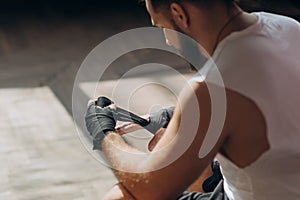 Man Boxer Wrapping Hands Getting Ready for a Fight. Wrapping Hands for Boxing Gloves