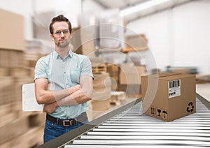man with boxes on conveyor belt in warehouse