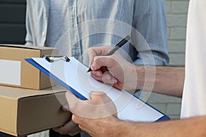 Man with boxes and delivery man outdoor