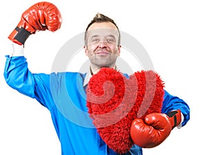 Man with boxing gloves holding heart