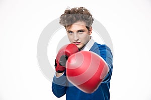 Man in boxing gloves punching at the camera