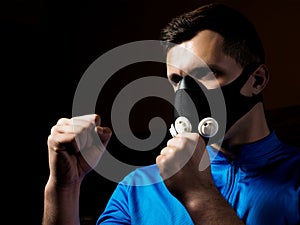 Man boxing in training mask