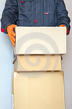 man with boxs. cardboard boxs. loader, courier