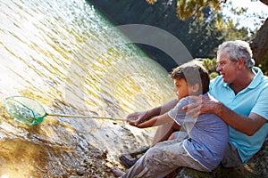 Man and boy fishing together