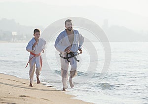 Man and boy practising karate