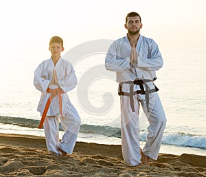 Man and boy practising karate