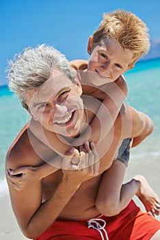 Man with boy at sea beach
