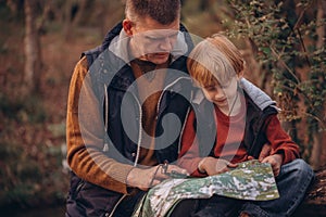 Man and boy tourists autumn time leisure, vacation hiking or traveling touristic activity.