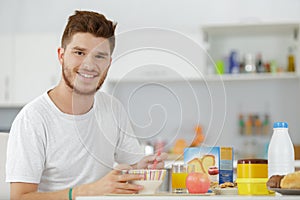 man at breakfast table looking sideways photo