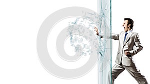 Man breaking glass