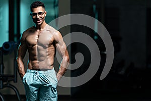 Man With Breasts Problem Flexing Muscles