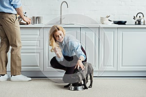 Man brewing coffee and blonde woman