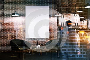 Man in brick wine cellar, armchairs and poster