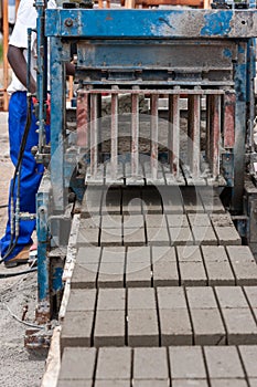 Man and bricks machine