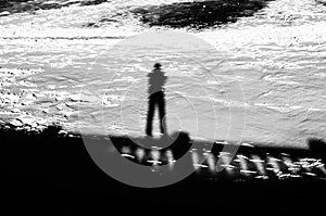 Man On Bridge Abstract Shadow On Snow