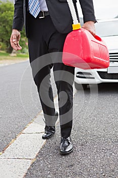 Man bringing petrol canister after broken down