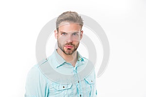 Man with bristle on strict face, isolated on white background. Man with beard or unshaven guy looks handsome and well