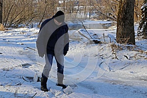 A man broke into the ice in winter. Dangerous thin ice