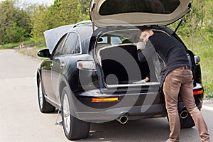 Man broken down at the roadside with his car