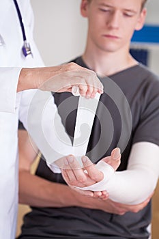 Man with broken hand photo