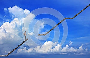 Man and broken step with blue sky background