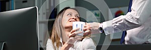 Man brought woman cup tea workplace coffee break