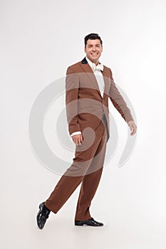 Man in brown suit