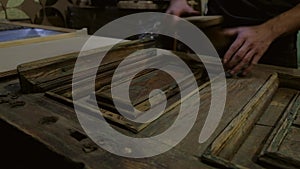 Man brushes old wooden door