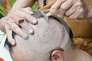 Man during a Buddhist ordination ceremony