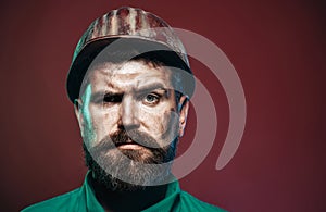 Man builder. Closeup portrait of serious male architect, contractor or engineer in safety helmet. Handsome construction