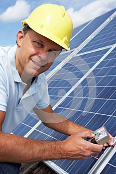 Man builder installing solar panels