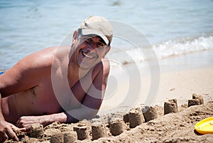 Man building castles on the sand