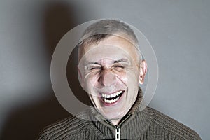 Man Bursting Into Laugh