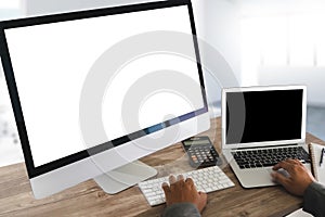 Man of business man hand working on laptop computer on wooden desk Laptop with blank screen on table