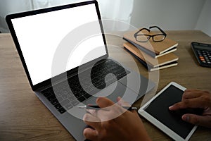 Man of business man hand working on laptop computer on wooden desk Laptop with blank screen laptop  on table