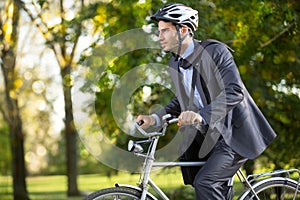 Man in a business suit on bicycle