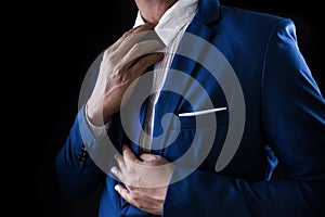 Man in business suit, business man on black background