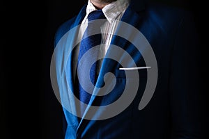 Man in business suit, business man on black background